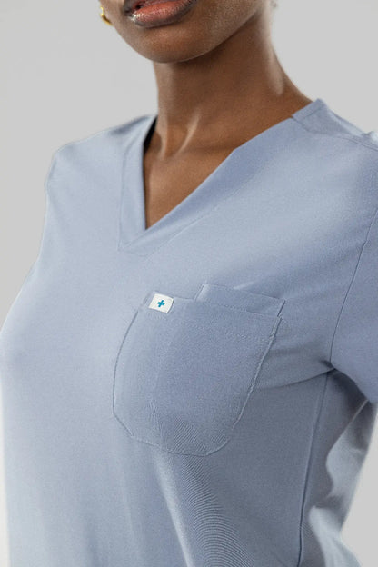Eipnare Women's Classic V-Neck Scrub Top in blue grey, model photo